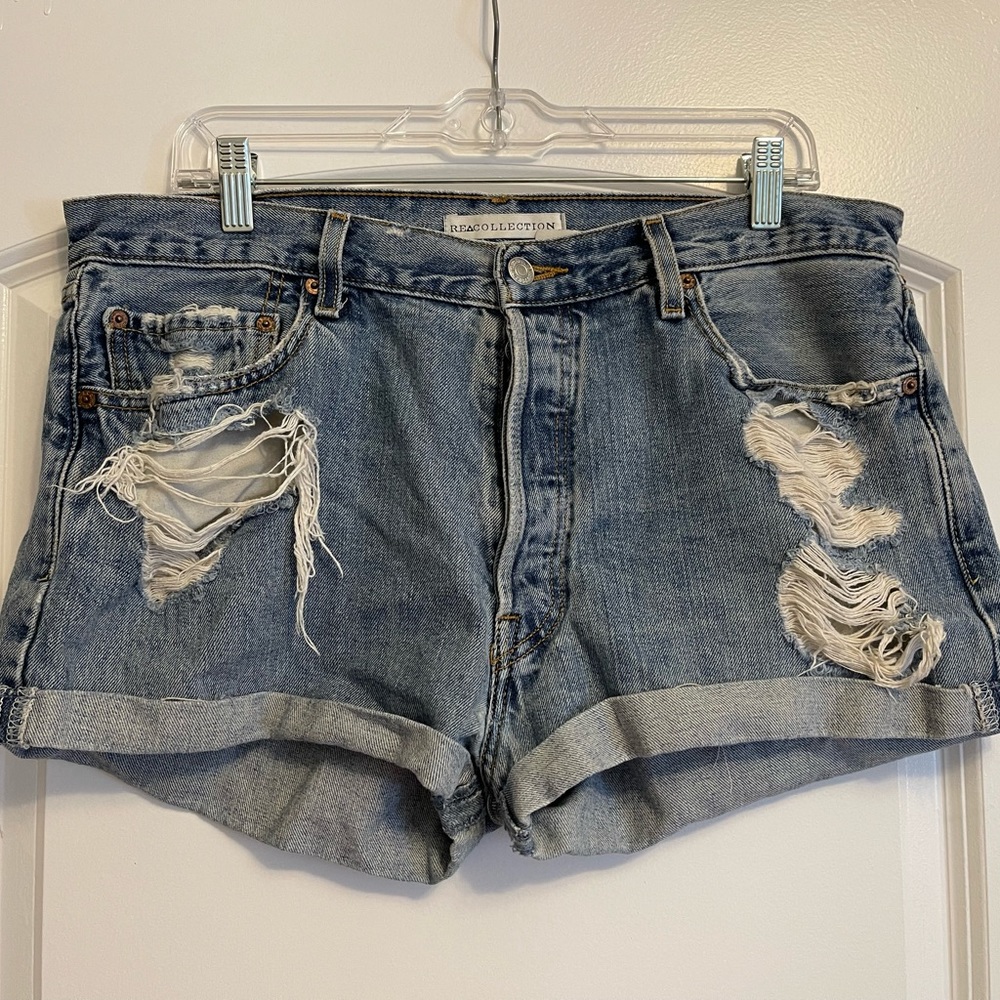 Vintage Levi’s distressed jean shorts by Re Collection